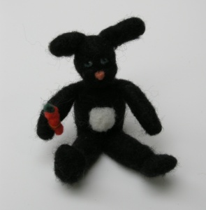 Sheldon the Black Bunny with a Carrot